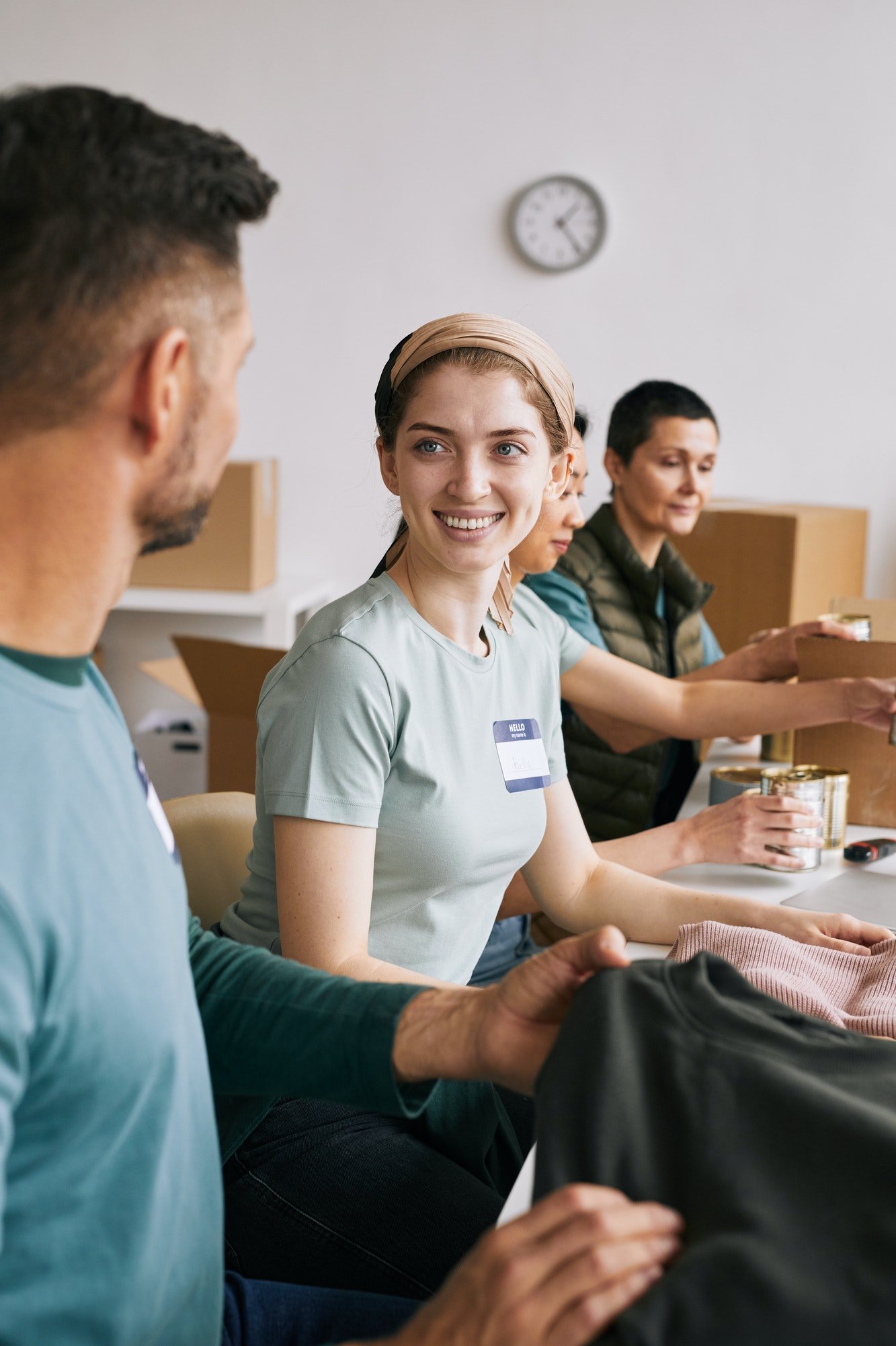 smiling-volunteers-in-donations-center.jpg